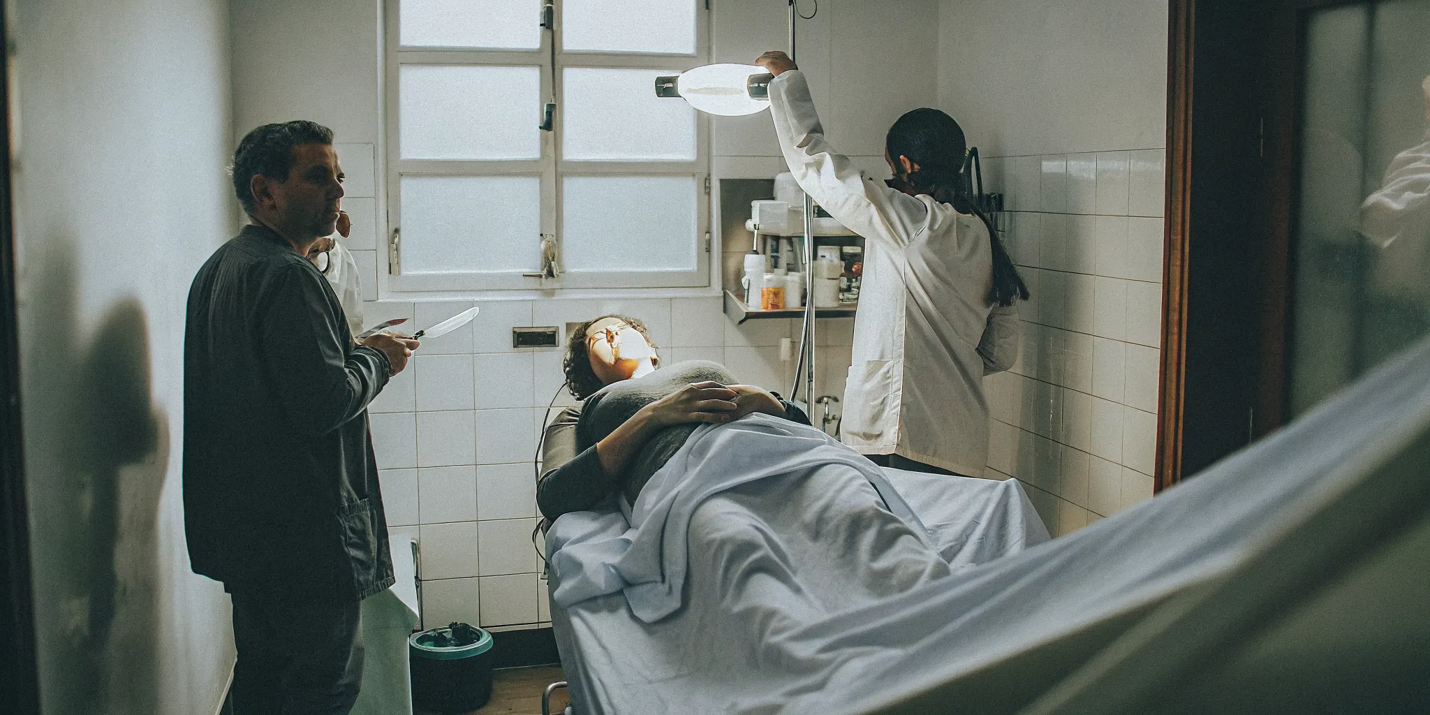 Patient preparing for a cervical epidural steroid injection in a clinical procedure room
