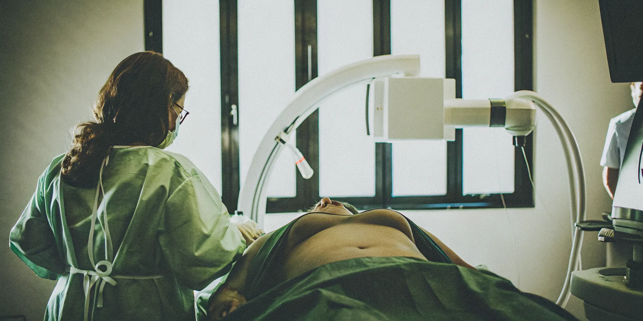 Medical professional reviewing fluoroscopic imaging during a radiofrequency ablation procedure