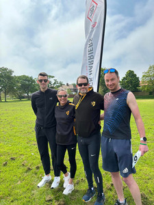 Blaydon athletes in front of a flag