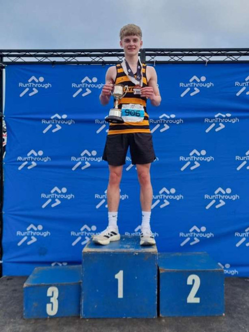 James Cathey on the podium at the Quayside 5k and Junior 3k