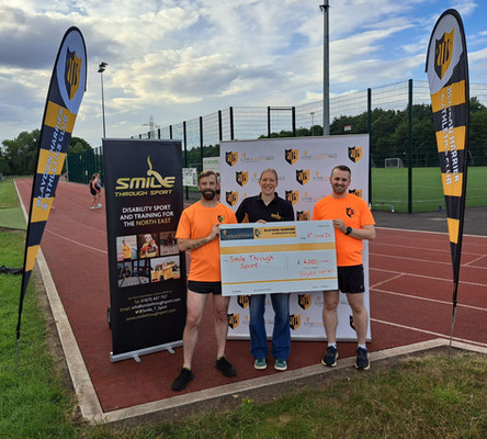 Blaydon Harriers present a cheque to Smile Through Sport