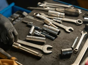 caucasian-worker-arranges-tools-on-260nw-2733402573_edited.jpg