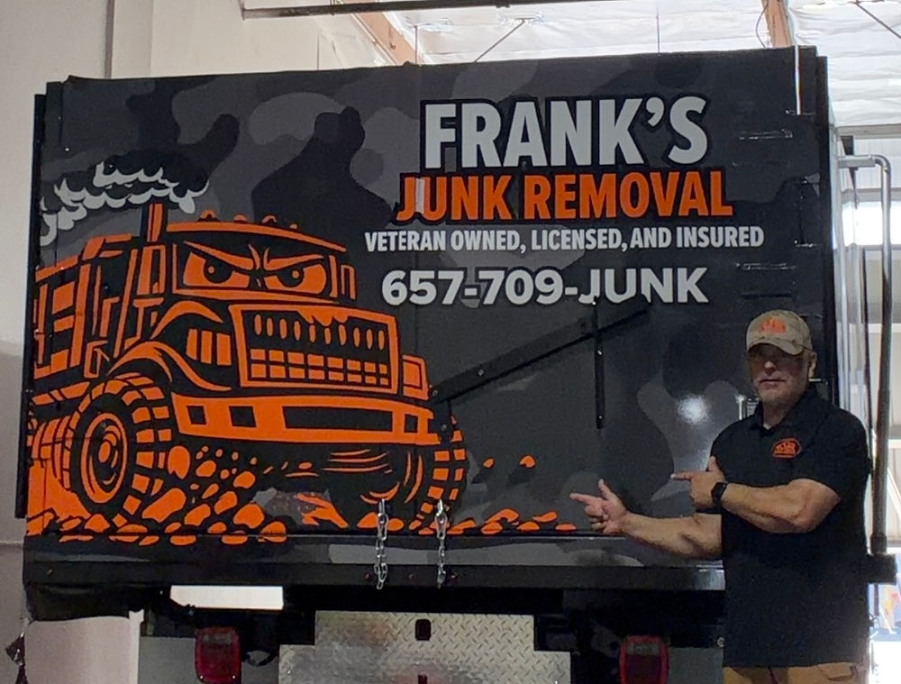 Frank Lopez standing next to a Frank's Junk Removal truck in Orange County