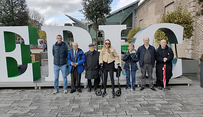 The BADIG team in front of the large EPIC sign during a visit to the Irish Emigration Museum in Dublin.