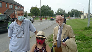Lana in a wheelchair with another BADIG committee member and the former Chairperson during a site visit to inspect a new road junction, all wearing face masks.
