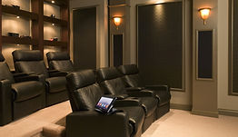 Dedicated home theater room with projector, custom lighting, and theater seating—installed by SmartVolt in Albuquerque.