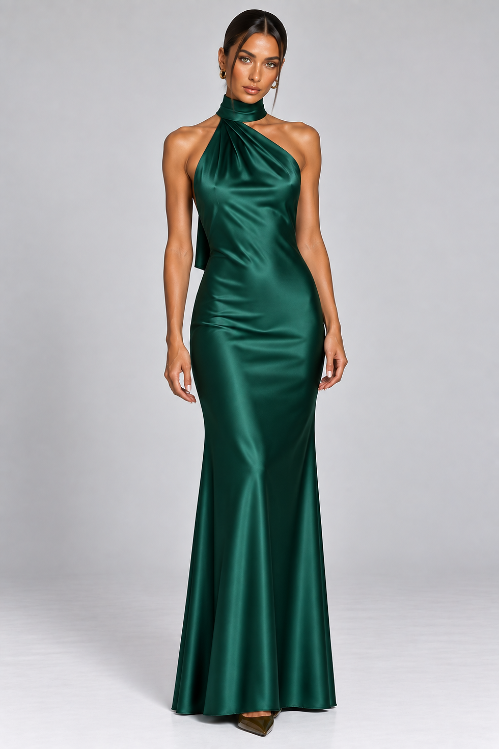 Thumbnail: Emerald green satin halter neck maxi dress with asymmetric neckline, fitted silhouette and floor-length skirt.