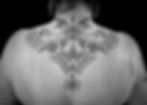 Ornamental upper back tattoo, by Dagga