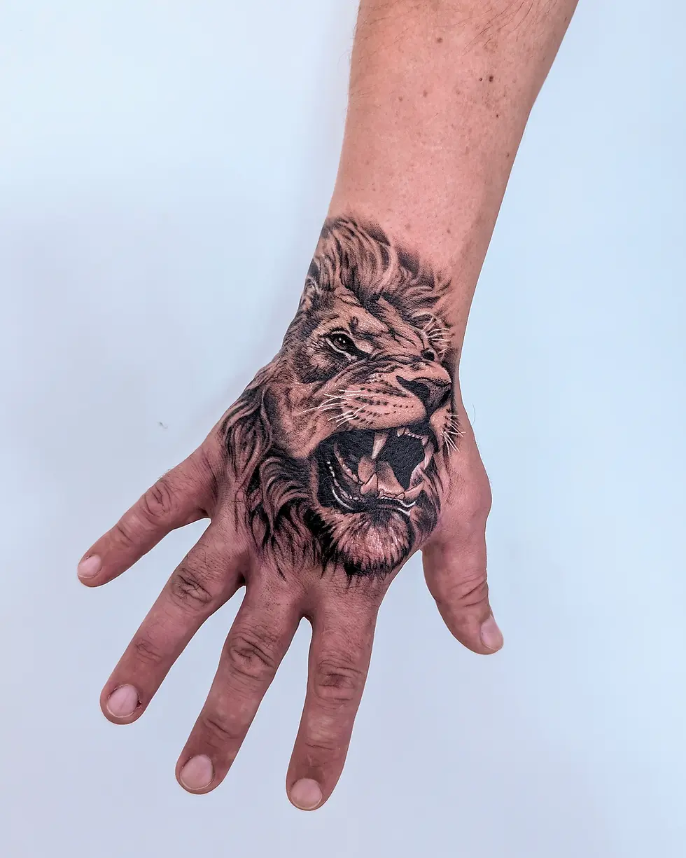 Realistic black and grey roaring lion hand tattoo, by Domi