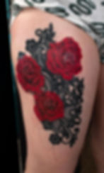Realistic coloured tattoo of red roses and black embroidered lace, by Dagga