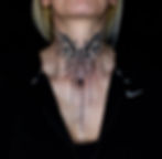 Black and grey dotwork neck tattoo of a butterfly, by Dagga