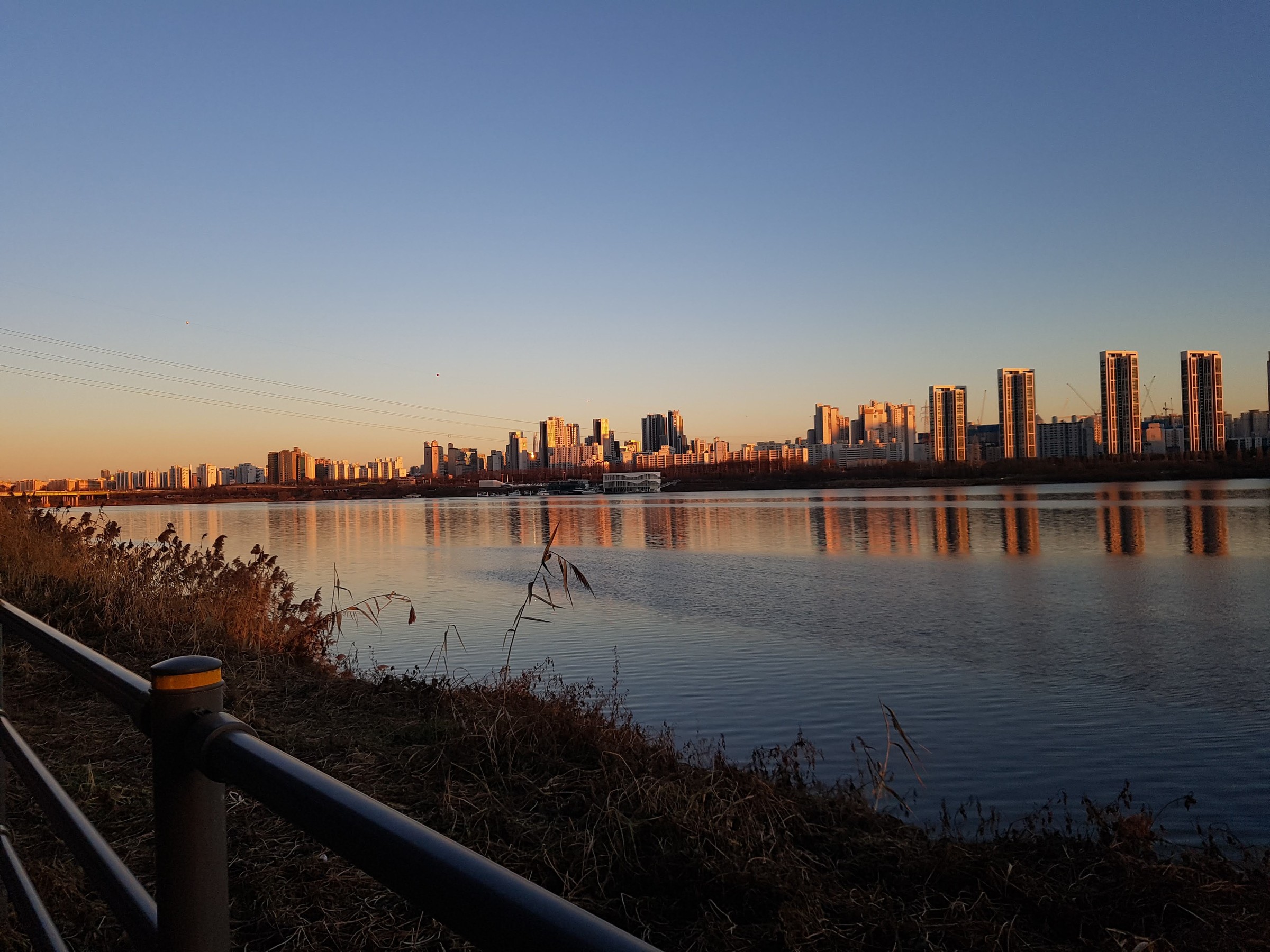 The Han River skyline in Seoul at sunset.