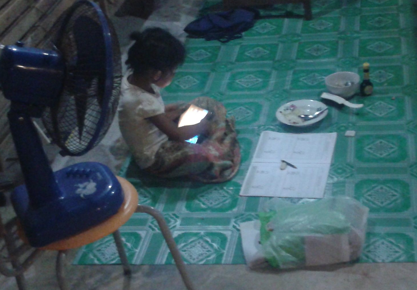 A child using a low-cost tablet computer.