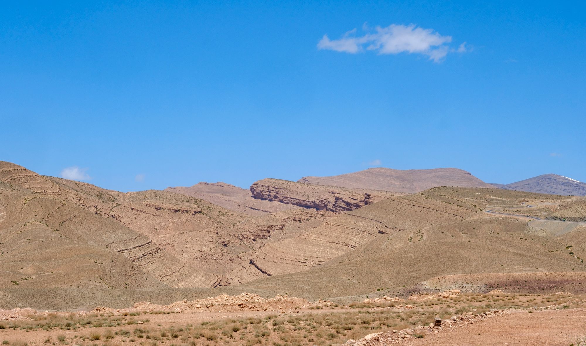 The Atlas Mountains in Morocco under a clear sky.