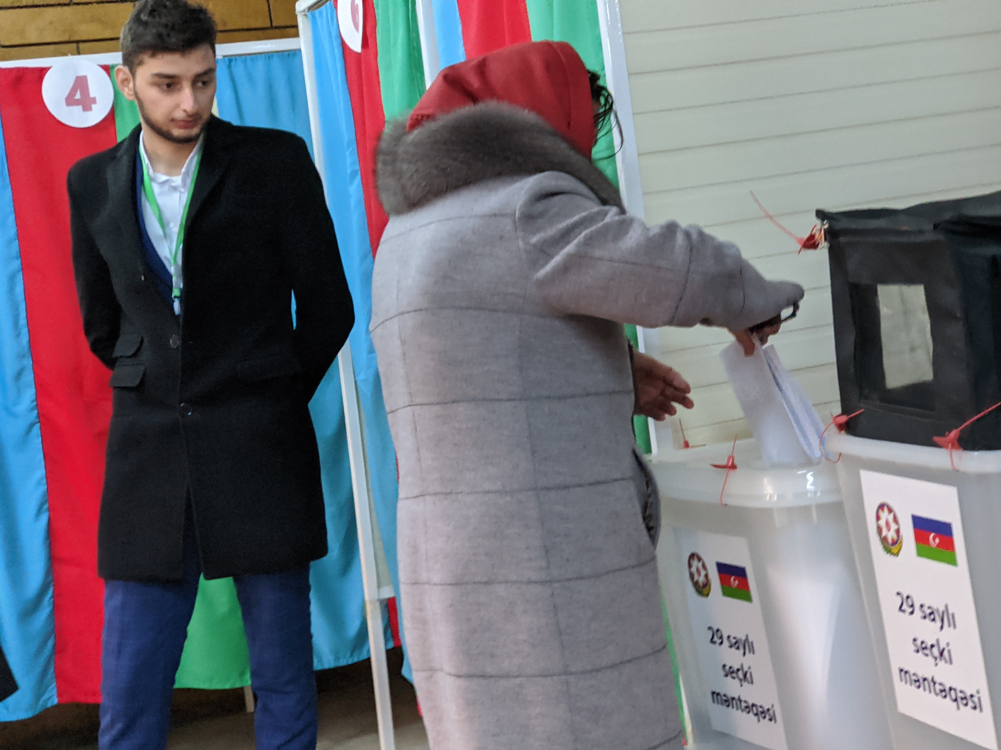 A voter casting a ballot at polling station No. 29 in Baku, Azerbaijan.