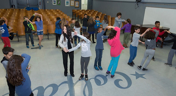 Kids learning to ballroom dance.