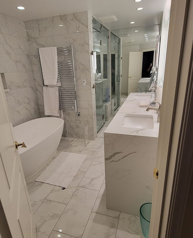 Completed Bathroom, marble floor to ceiling with a feature steam curb less shower