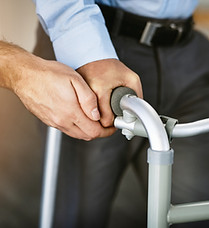 Hands, walker and help for person with disability in nursing home, physiotherapy with empa