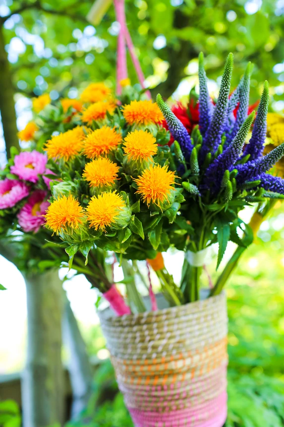 Summer flowers bouquet in an august basket