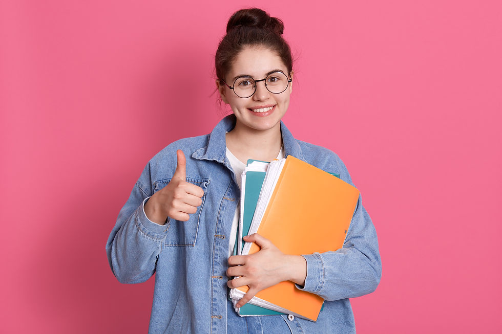 young-student-woman-wearing-denim-jacket-eyeglasses-holding-colorful-folders-showing-thumb