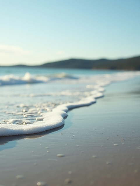 Eye-level view of the serene Peter Bay Beach with gentle waves