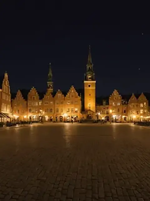 Wide angle view of a historic town square at night, perfect for a ghost tour