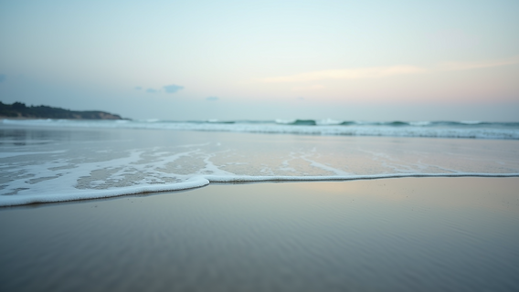 Eye-level view of the calming tide at Fourchon Beach