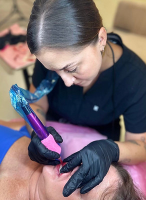 The Inked Palette owner/artist performing lip blush permanent makeup