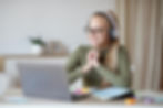 girl-in-headset-looking-at-laptop-screen-watching-online-lesson-p9f5rjcwxzphv42gc19jw8acc7