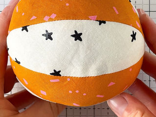 A white and orange fabric basketball