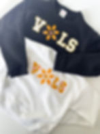 DIY Sweatshirts using reverse appliqué and raw edge appliqué techniques. The sweatshirts have flowers with footballs as the petals
