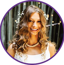 Our instructor, Miss Aly, has long curly brown hair and a warm smile, dressed up in a white dress with white flowers tucked in her hair.