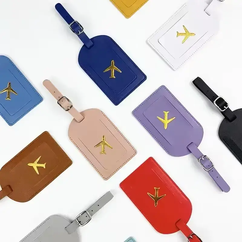 The Voyager leather-look luggage tag with gold aeroplane embossing and privacy ID card for suitcases and travel bags.