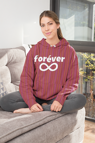 sublimated-pullover-hoodie-mockup-featuring-a-young-woman-sitting-on-a-fabric-couch-31248.