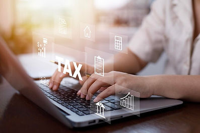 hand-using-laptop-with-tax-refund-refund-tax-duty-taxation-business-graphs-chart-being-dem