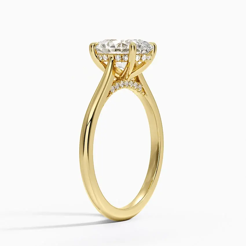 Thumbnail: Remi - 14k Oval Cut Solitaire with Hidden Halo and Studded Bridge