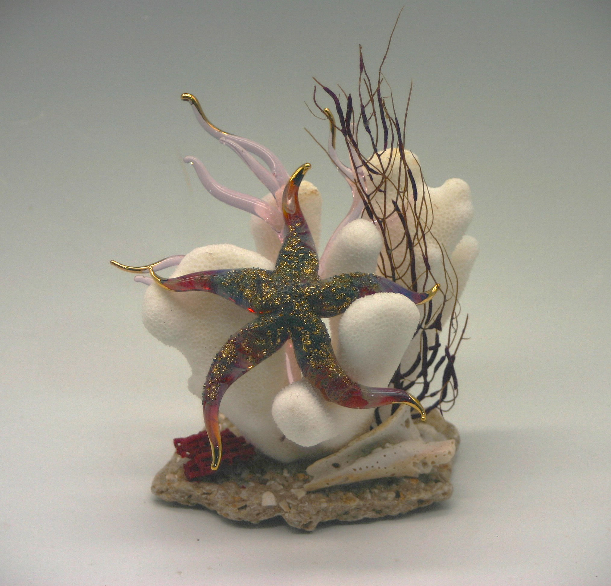 Stafish, small in Red Amber Purple on coral/stone base