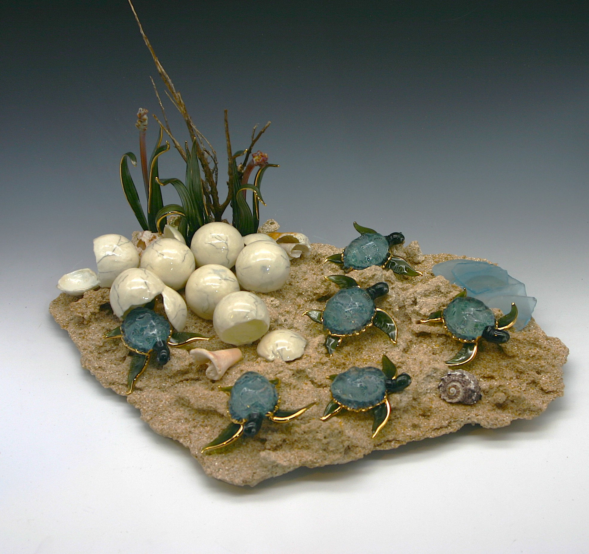 Sea turtle hatchlings on natural Sandstone Base