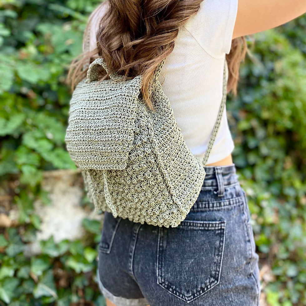 woman modelling crochet green backpack