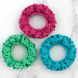 crochet scrunchies, pink, blue and green.