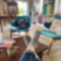socked feet on living room coffee table