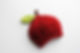 knit red hat with stem and leaf to resemble an apple