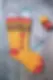 knit pride socks on metal sock displays
