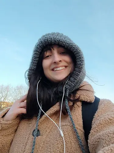 brunette woman casually modelling hooded cowl