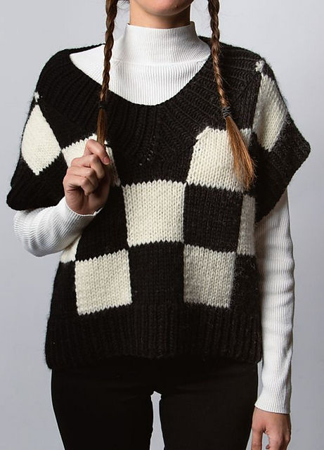 woman modelling Wednesday inspired checkered vest