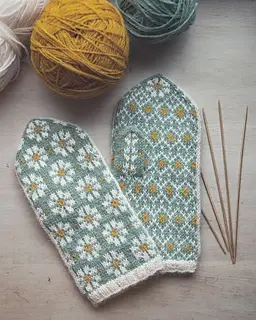 hand knit latvian style daisy mittens with intricate repeatng design