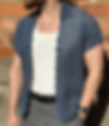 men modelling crochet shirt in front of brick wall