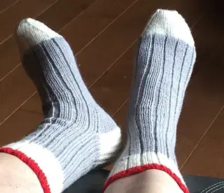canadian work socks knit in grey, off white and red yarn