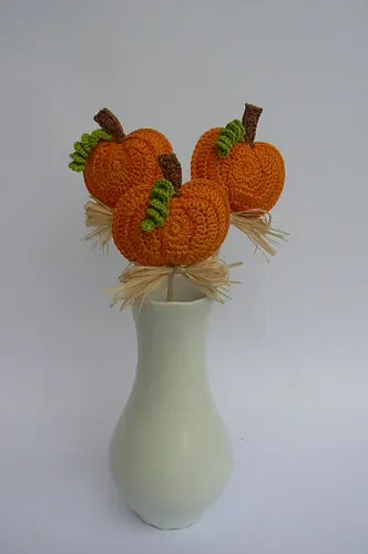 A very simple autumn / Halloween decoration -a pumpkin on a wooden stick.