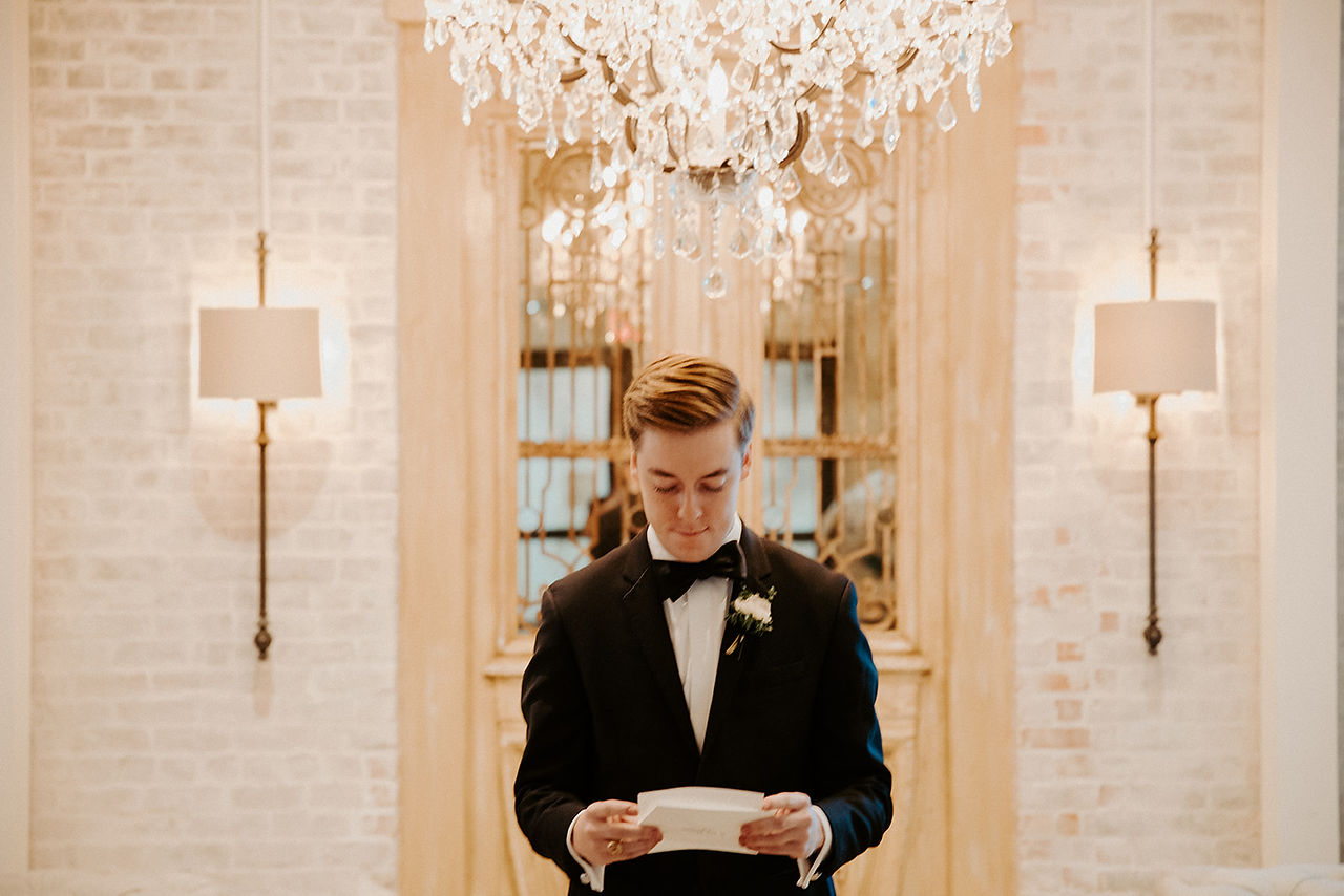 groom reading letter from the bride 